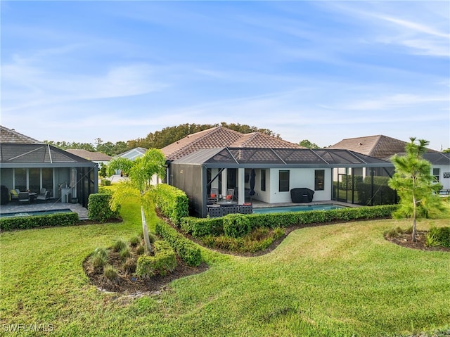 13840 Amblewind Cove Way, Fort Myers, FL 33905 - back of house with glass enclosure, a yard, an outdoor pool, and stucco siding