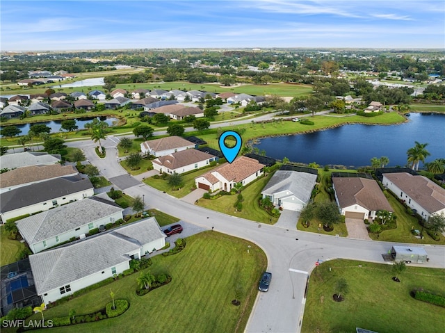 drone / aerial view with a water view