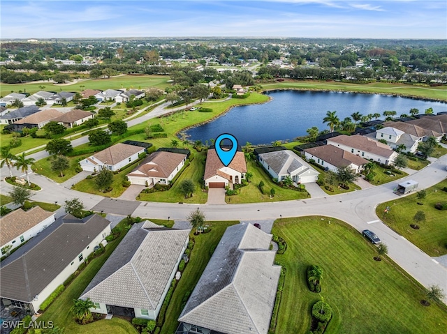 bird's eye view with a water view and a residential view
