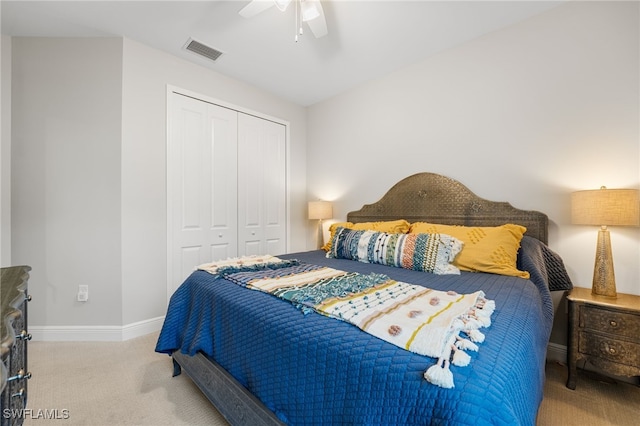 bedroom with light carpet, a closet, and ceiling fan