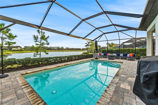 view of swimming pool with outdoor lounge area, a patio, a water view, and a lanai