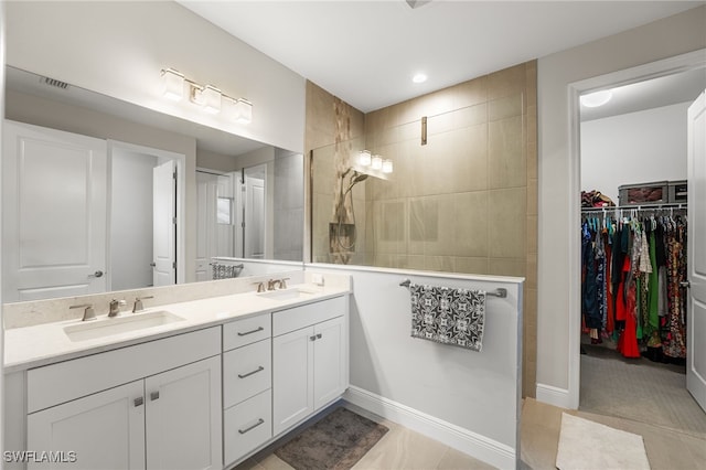 bathroom with tile patterned flooring and vanity