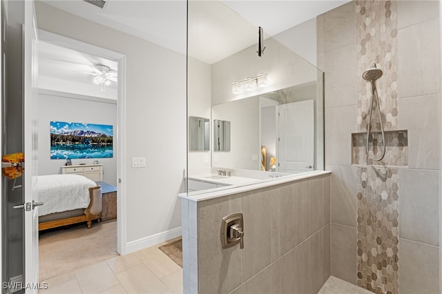 bathroom featuring tiled shower, tile patterned floors, ceiling fan, and sink