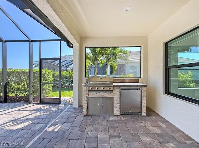 13840 Amblewind Cove Way, Fort Myers, FL 33905 - unfurnished sunroom featuring exterior kitchen