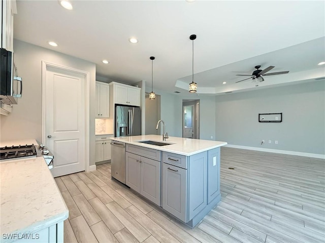 13840 Amblewind Cove Way, Fort Myers, FL 33905 - kitchen featuring stainless steel appliances, a sink, light wood-style flooring, light countertops, and recessed lighting