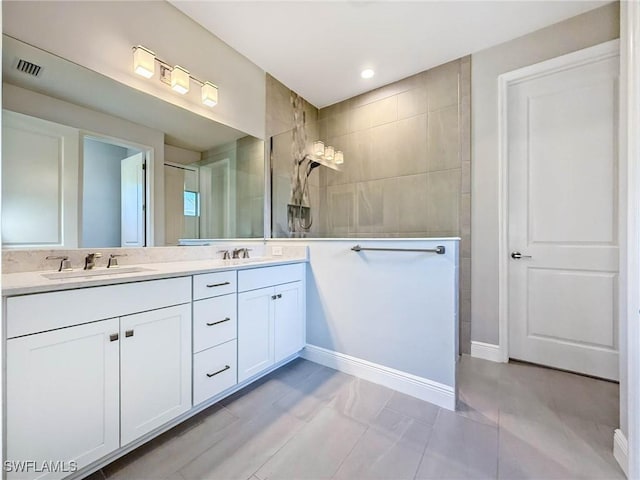 13840 Amblewind Cove Way, Fort Myers, FL 33905 - full bath featuring double vanity, walk in shower, and baseboards