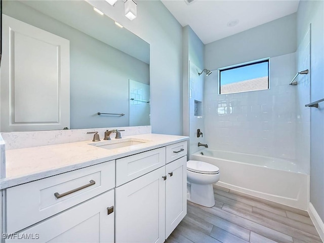 13840 Amblewind Cove Way, Fort Myers, FL 33905 - bathroom with vanity, toilet, washtub / shower combination, and wood finished floors