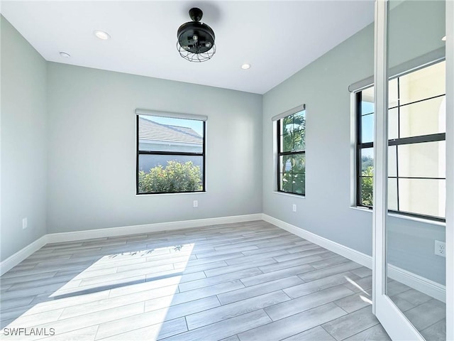 13840 Amblewind Cove Way, Fort Myers, FL 33905 - empty room featuring baseboards, light wood-style flooring, and recessed lighting