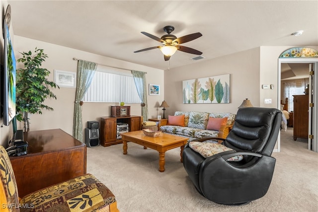 living room with light carpet and ceiling fan