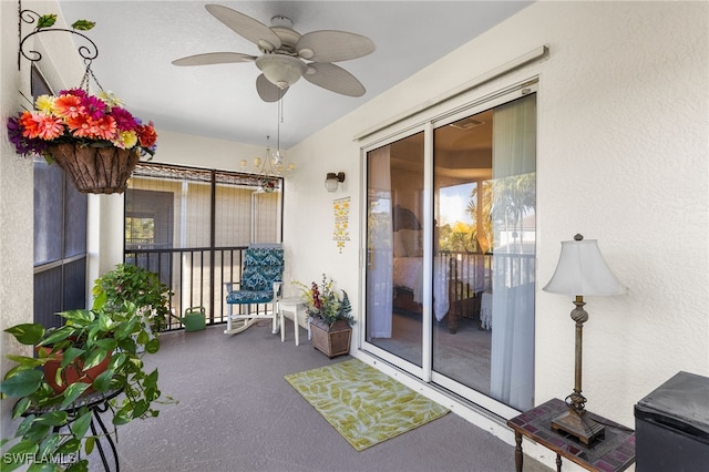 sunroom featuring ceiling fan