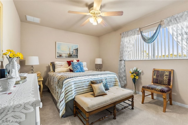 bedroom with ceiling fan and light colored carpet