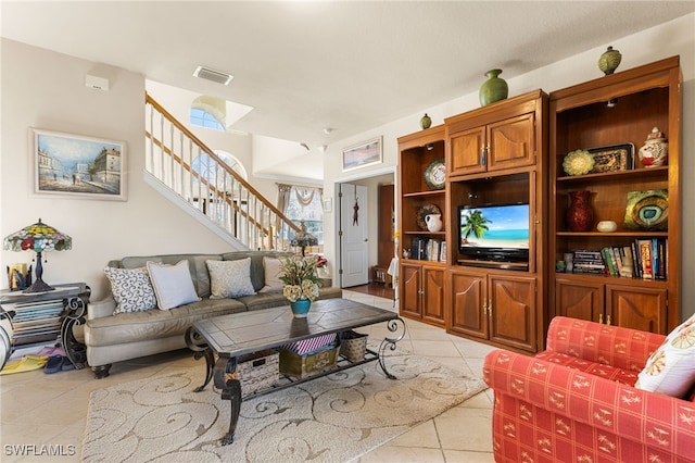 living room with light tile patterned floors