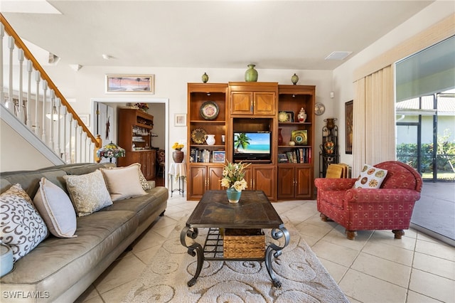 living room with light tile patterned flooring