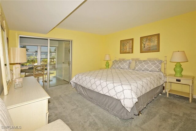 bedroom featuring carpet floors and access to outside