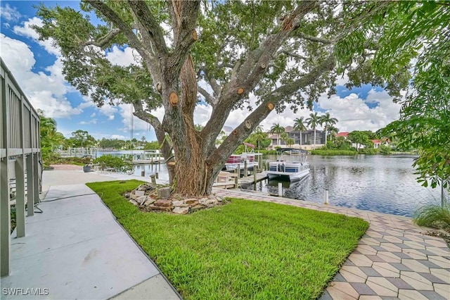 exterior space featuring a water view and a boat dock