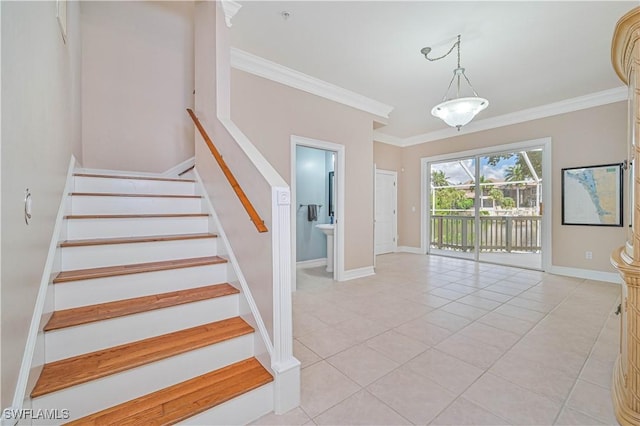 staircase with baseboards, tile patterned floors, and crown molding