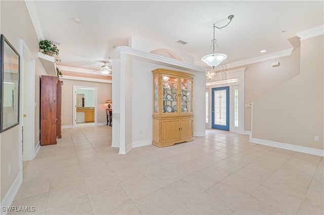 entrance foyer featuring ceiling fan, light tile patterned floors, visible vents, baseboards, and crown molding