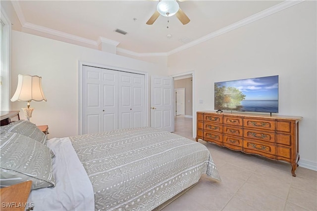 bedroom with a closet, visible vents, crown molding, and tile patterned floors