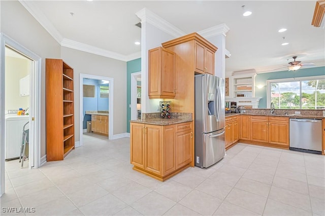 kitchen with stainless steel appliances, recessed lighting, dark stone countertops, and crown molding