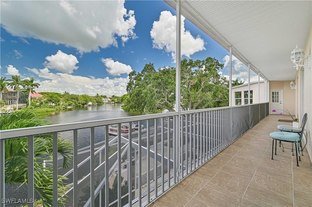 balcony featuring a water view