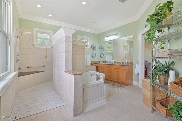 bathroom with tile patterned flooring, a garden tub, crown molding, and a walk in shower