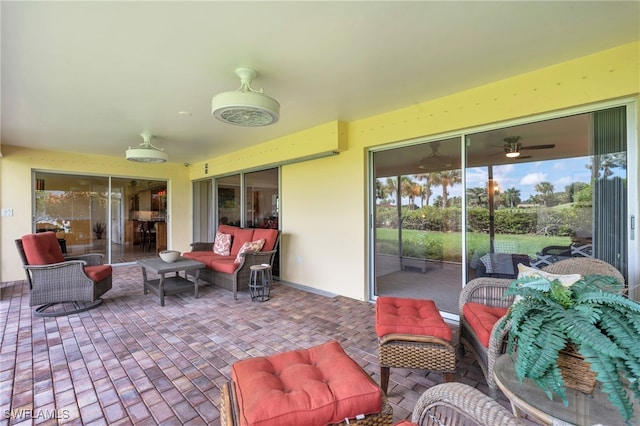 view of patio / terrace with ceiling fan and outdoor lounge area