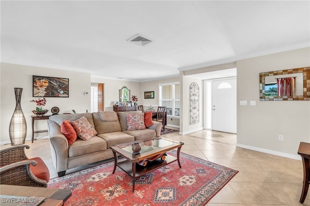 tiled living room featuring ornamental molding