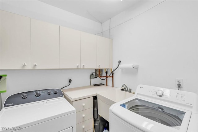 laundry area featuring cabinets and independent washer and dryer