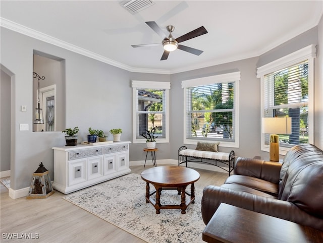 living room featuring ornamental molding, ceiling fan, and light hardwood / wood-style floors