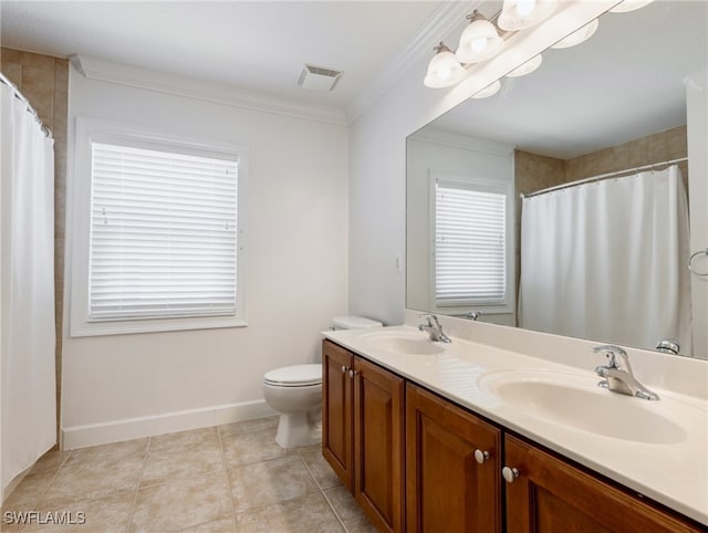 bathroom with crown molding, vanity, toilet, and tile patterned flooring