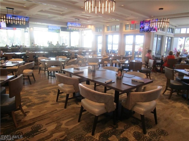 dining area featuring coffered ceiling