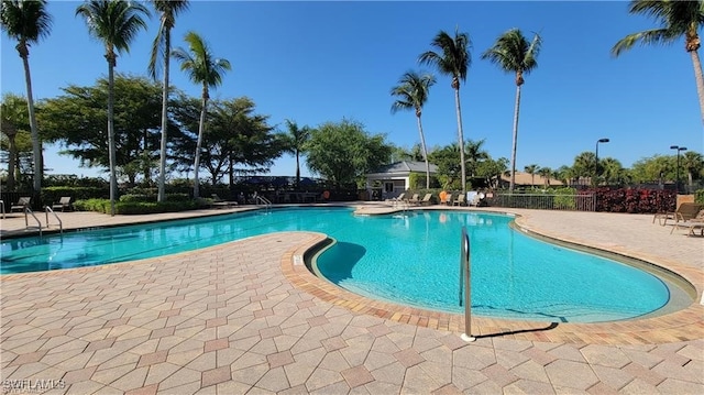 view of swimming pool with a patio