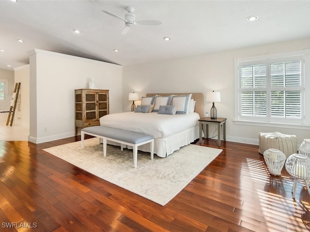 bedroom featuring lofted ceiling, ceiling fan, dark hardwood / wood-style flooring, and ornamental molding