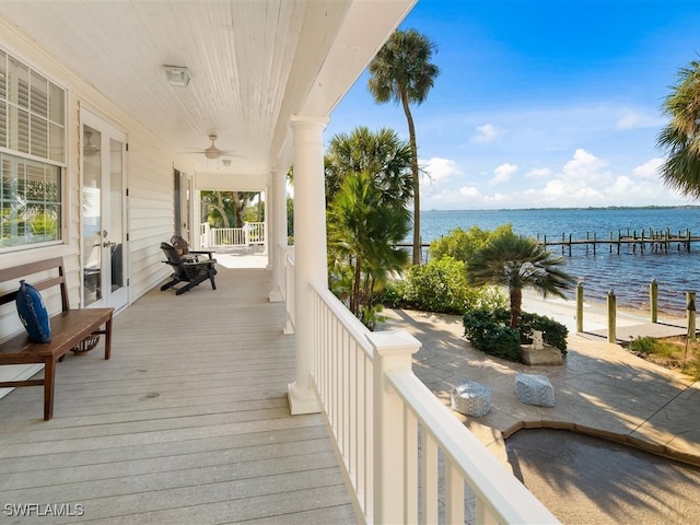 wooden deck featuring a water view