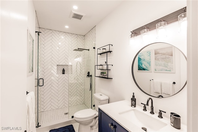 bathroom with vanity, toilet, an enclosed shower, and tile patterned flooring