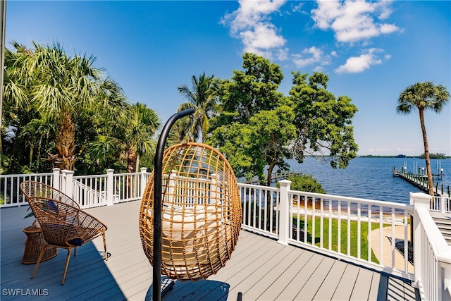 wooden terrace featuring a water view