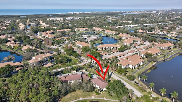 birds eye view of property featuring a water view