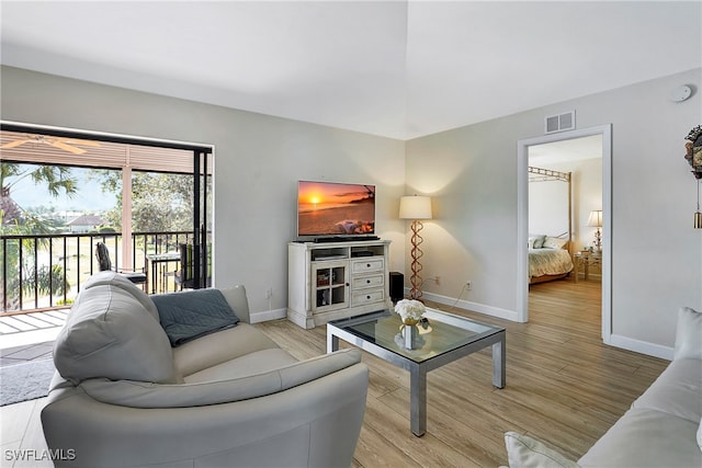 living room with light hardwood / wood-style floors