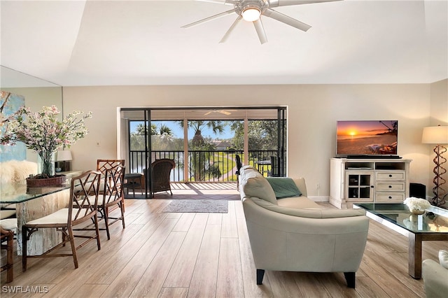 living room featuring light wood-type flooring and ceiling fan