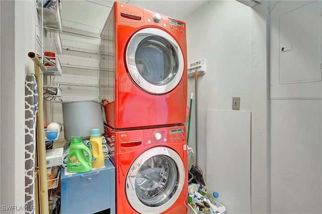 laundry area featuring stacked washer and clothes dryer