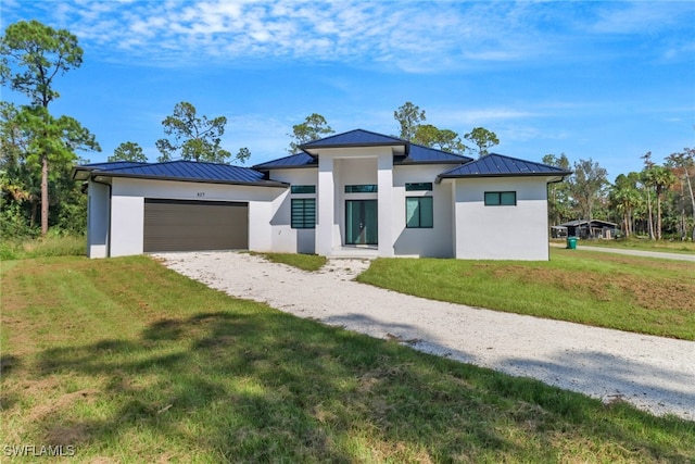 view of front facade featuring a front yard and a garage