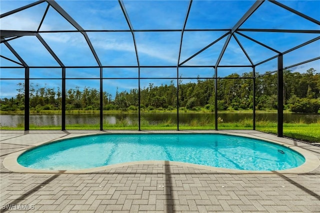 view of swimming pool featuring a lanai, a water view, and a patio