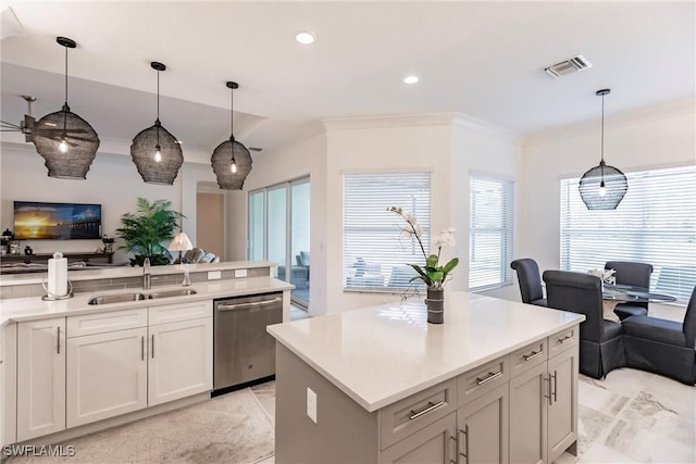 kitchen featuring stainless steel dishwasher, a center island, pendant lighting, and sink