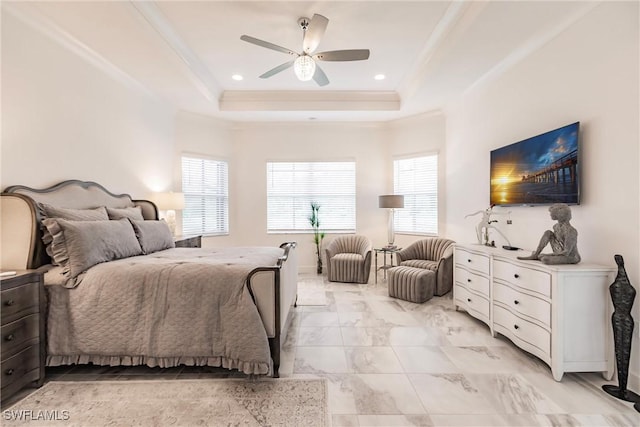 bedroom featuring a raised ceiling, ceiling fan, and ornamental molding