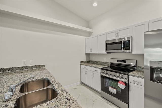 kitchen with appliances with stainless steel finishes and white cabinetry