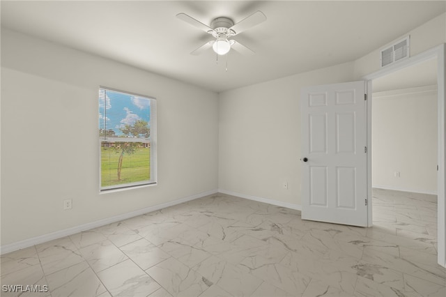 spare room featuring ceiling fan