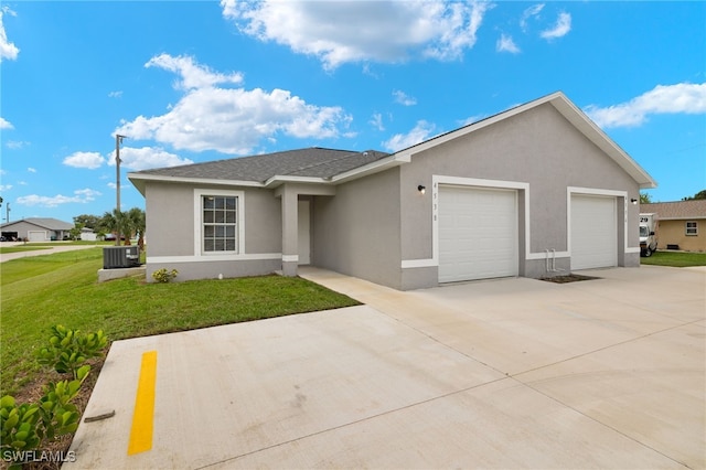 ranch-style home with a front lawn, a garage, and central AC