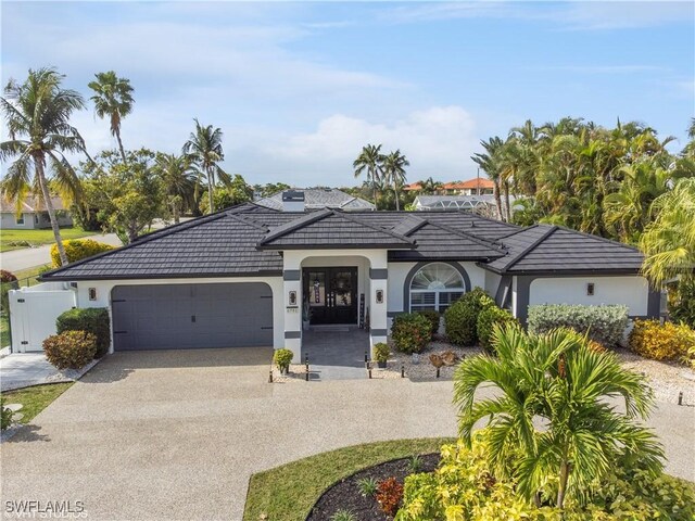 single story home featuring a garage