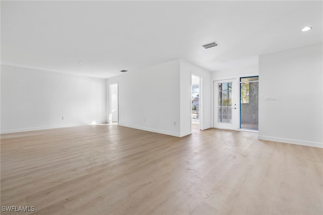 unfurnished living room featuring light hardwood / wood-style flooring