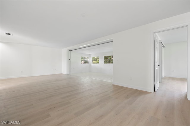 unfurnished living room with light hardwood / wood-style flooring